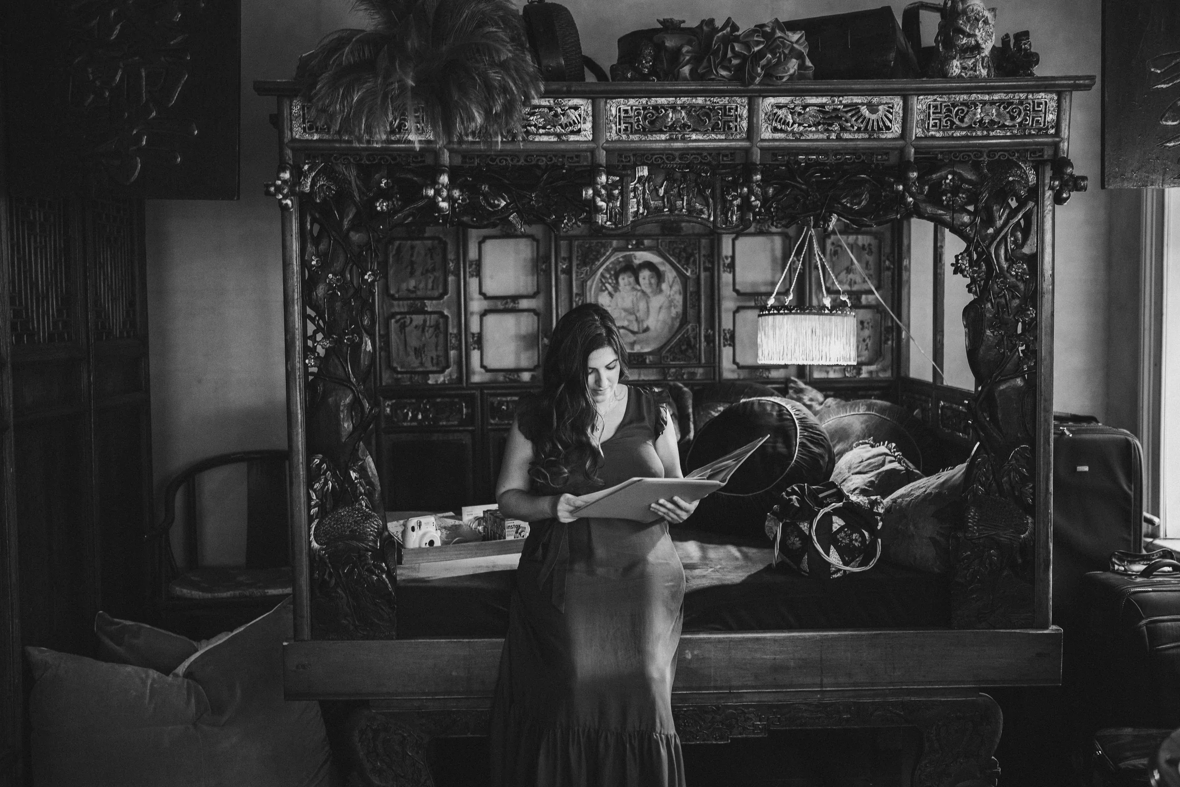 Wide black-and-white portrait of Parisa in an ornate historic room