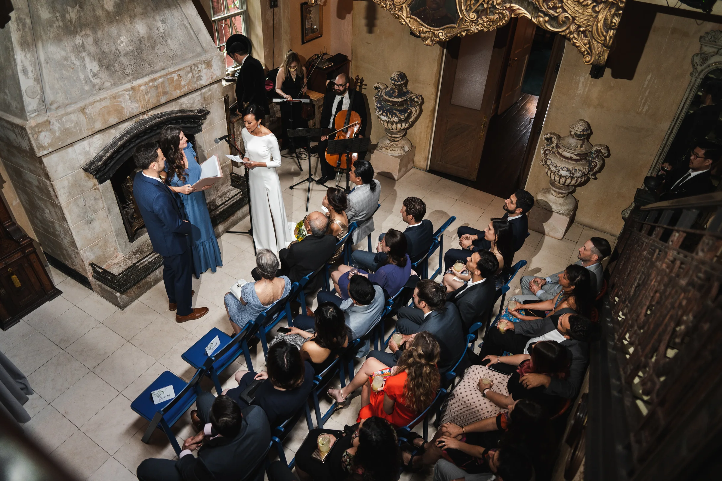 Aerial view of an outdoor wedding ceremony guided by Parisa