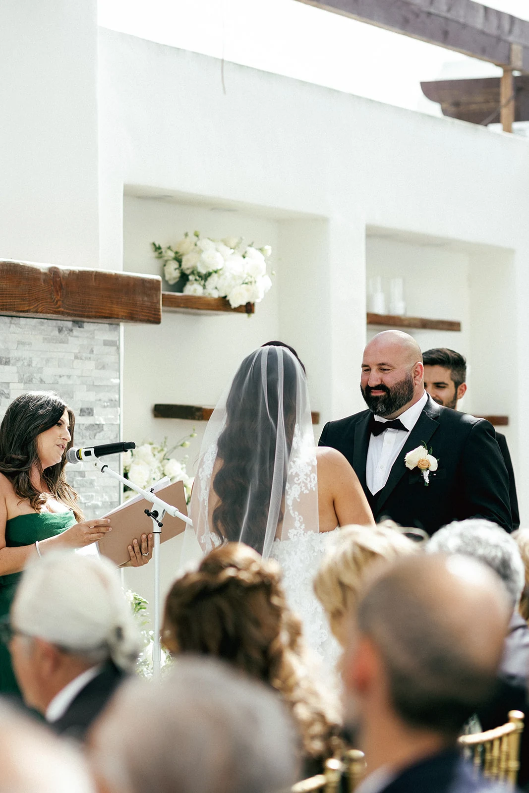 Parisa officiating as the couple faces one another before their guests
